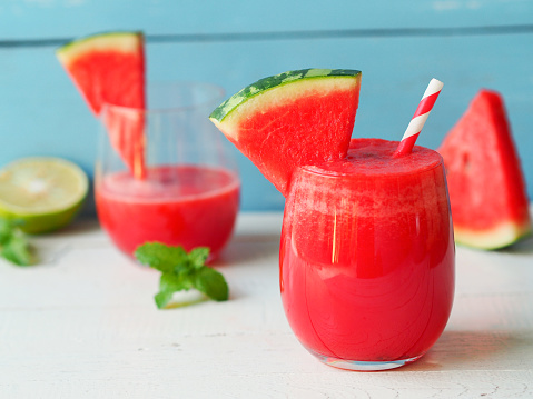 Watermelon smoothies topping with fresh watermelon for summer drinks concept.