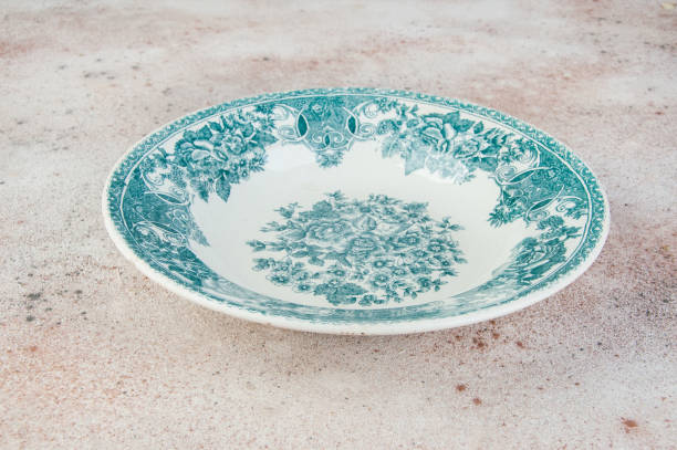 istock Antique porcelain dish on concrete background. 1218435236