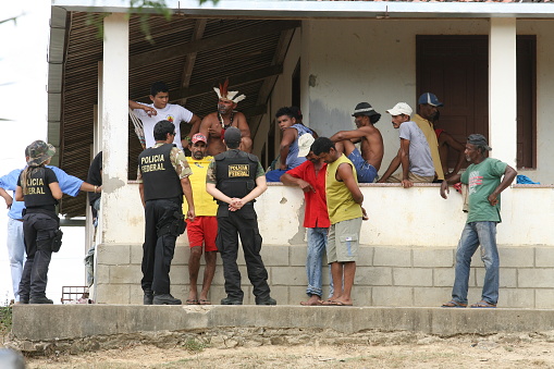 pau brasil , bahia / brazil  - april 16, 2012: Federal Police officers accompany a farm invaded by Pataxo Hahahae Indians in rural Pau Brazil.