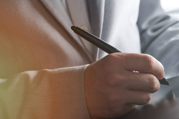 istock Businessperson sign online document 1218435315
