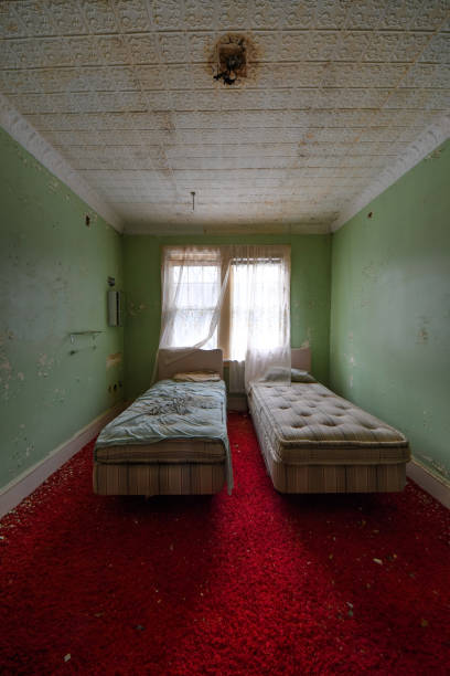 istock Beds in old hotel room A 1218435423