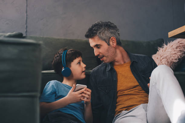 istock Father and son listening music. 1218436206