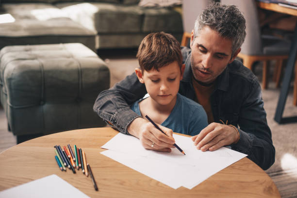 istock Excited man and boy drawing with joy 1218436210