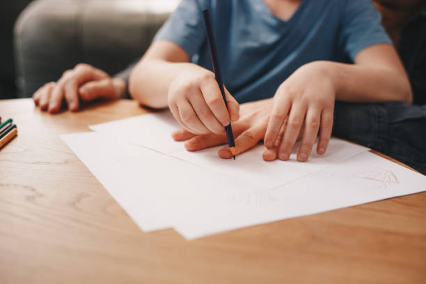 istock Excited man and boy drawing with joy 1218436215