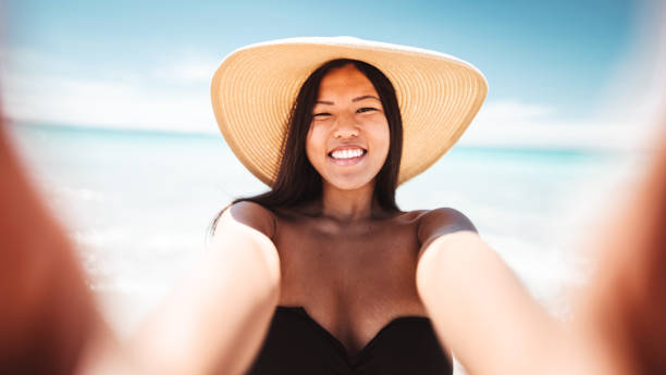 istock chinese woman take a selfie at home 1218437809