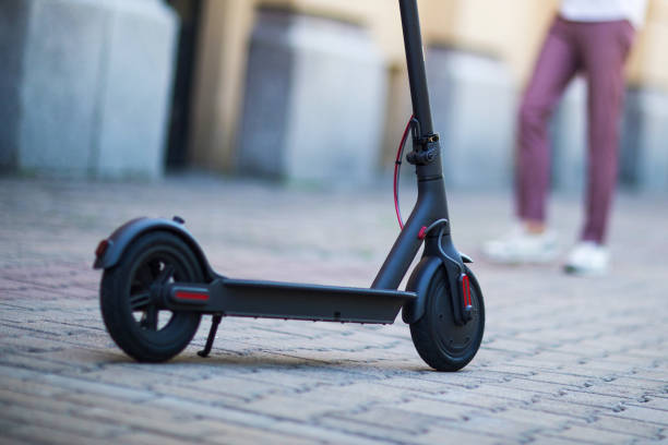 istock Eco friendly transport electro scooter city transport ride 1218438855