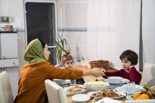 istock Muslim Family Having Iftar Dinner 1218439929
