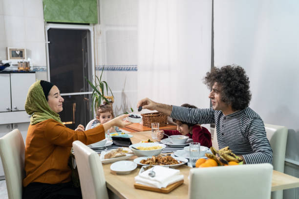 istock Muslim Family Having Iftar Dinner 1218439940