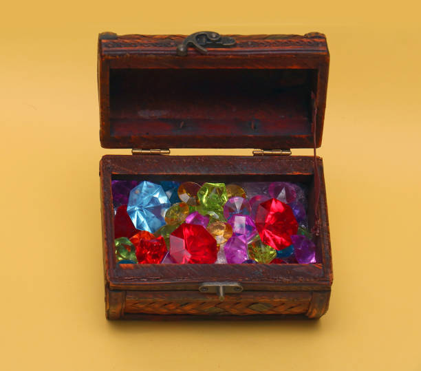 istock Colorful diamonds in wooden chest 1218441204