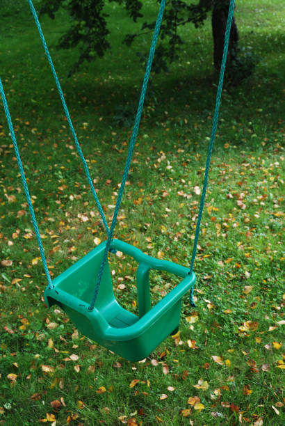 istock plastic swing on a rope in the garden 1218441877