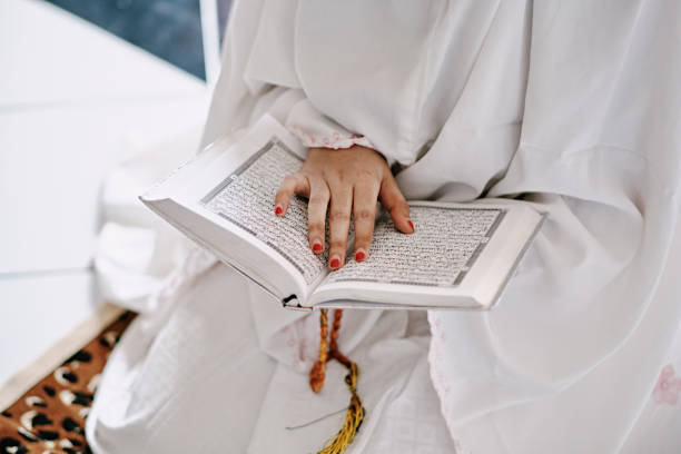istock Indonesian Hijab Women Reading Quran Inside a Mosque 1218444512