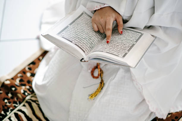 istock Indonesian Hijab Women Reading Quran Inside a Mosque 1218444532