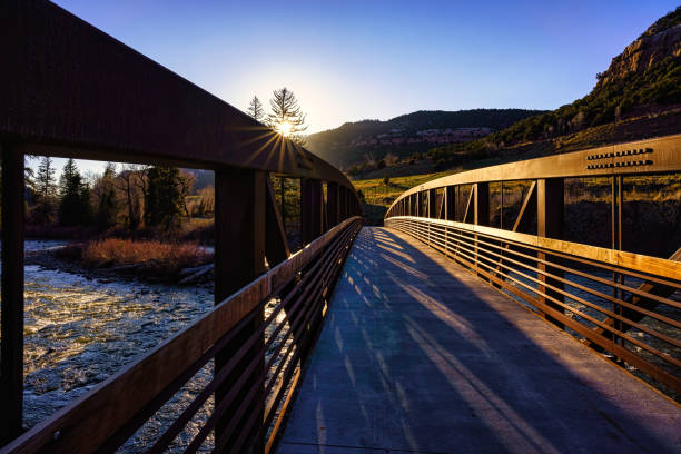 River and Metal Bridge At Sunset Along Recreation Path