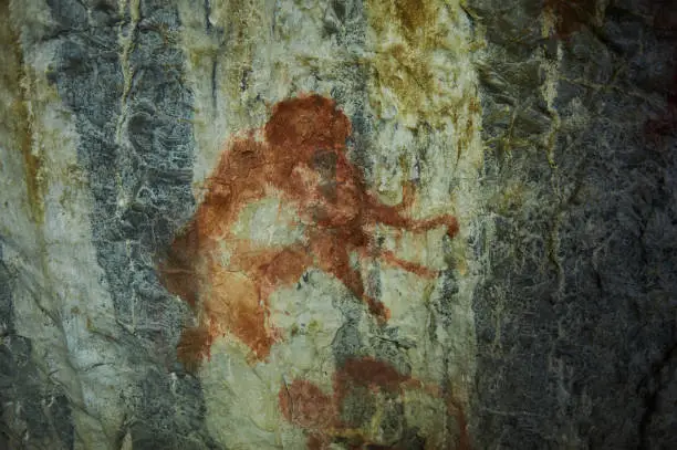 Rock paintings in a stone cave of an ancient prehistoric Neanderthal man. Mammoth. stone Age. Ice Age. Shulgan Tash Cave Russia Bashkiria.