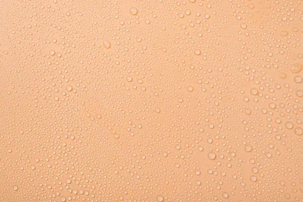 Photo of Top above overhead view photo of little drops of water on beige background