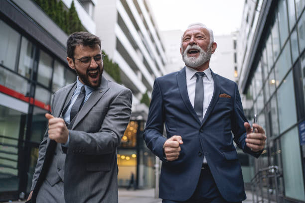 istock Business colleagues dancing while celebrating good news 1218451971