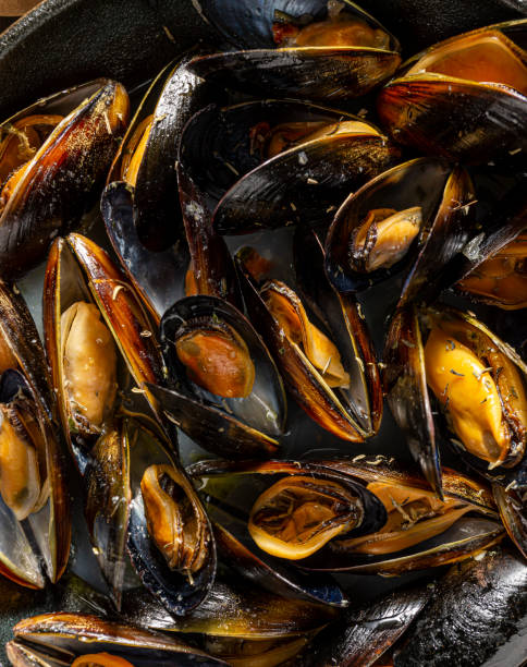 istock Steamed mussels in cast iron pot. 1218454296