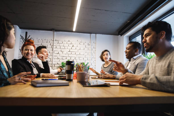 istock Group of diverse business partners having a brainstorming session 1218464290