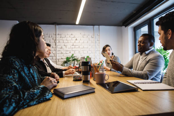 istock Group of multi-ethnic entrepreneurs having a brainstorming session 1218464300