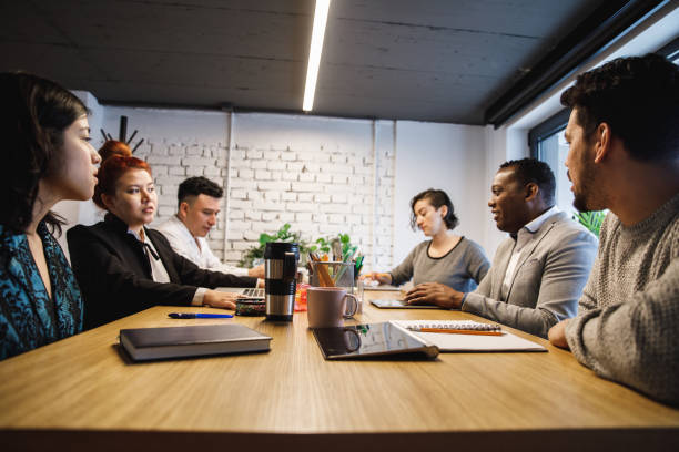 istock Group of multi-ethnic office colleagues having a business meeting 1218464309