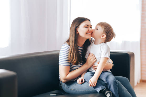 istock Mom with son cuddling 1218464353