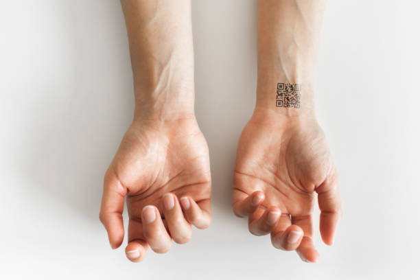 istock Hand with qr code on wrist. Future of political population control. Chipization of people. 1218464544