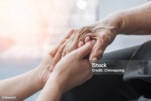 Parkinson Disease Patient Alzheimer Elderly Senior Arthritis Person Hand In Support Of Nursing Family Caregiver Care For Disability Awareness Day National Care Givers Month Ageing Society Concept Stock Photo - Download Image Now