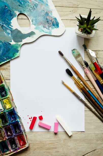 istock Creative artist workplace flat lay, mockup on wooden background 1218465534