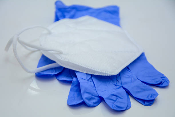 istock N95 mask and surgical glove on white background 1218465617