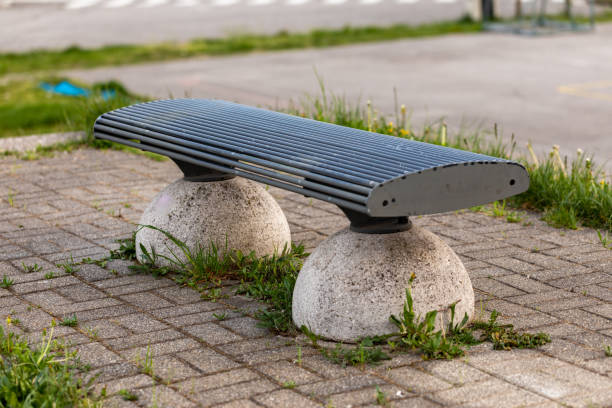 istock Vacant bench in an urban park in close up 1218469663
