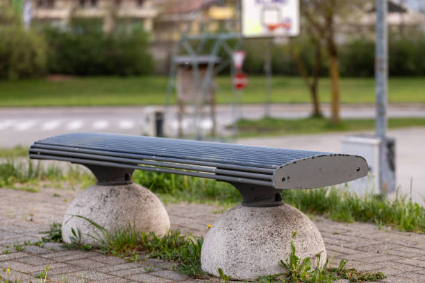istock Deserted bench in a city park in close up 1218469693