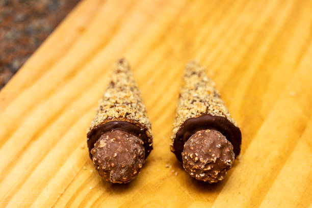 istock Ice cream cone stuffed with dulce de leche, chocolate, brigadeiro, coconut. 1218473126
