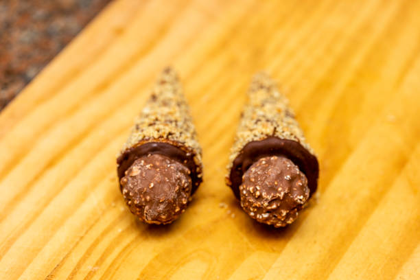 istock Ice cream cone stuffed with dulce de leche, chocolate, brigadeiro, coconut. 1218473147