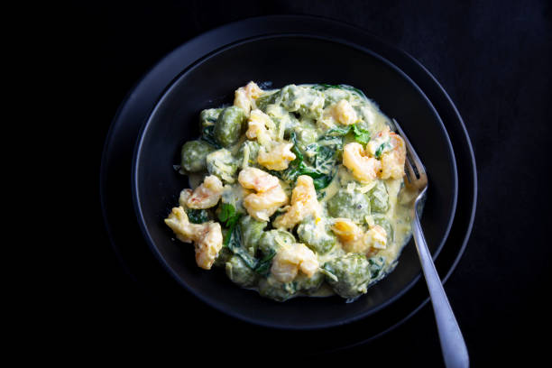 istock Creamy cheesy sauce spinach gnocchi with shrimp 1218474708