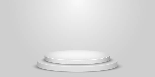 istock White and Grey Round Winner Podium Background. Stage for Awards Ceremony. Spotlights illuminate. Vector illustration. 1218475610
