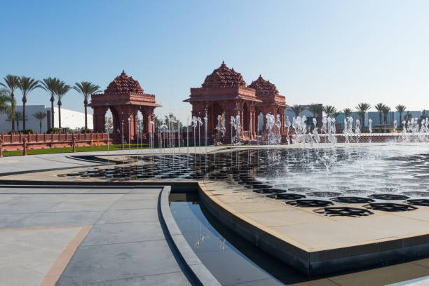 Lotus-Shaped Reflection Pond and Fountain at BAPS Shri Swaminarayan Mandir Hindu temple stock photo