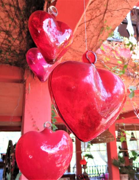 istock Small red glass hearts suspended. 1218483087