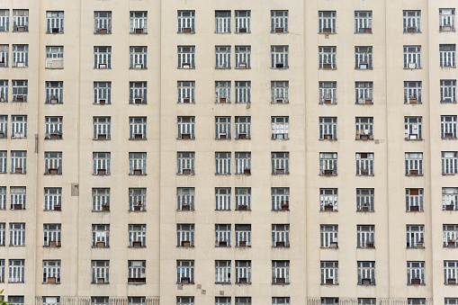 Close up of art deco building facade with windows pattern in the center of Rio de Janeiro