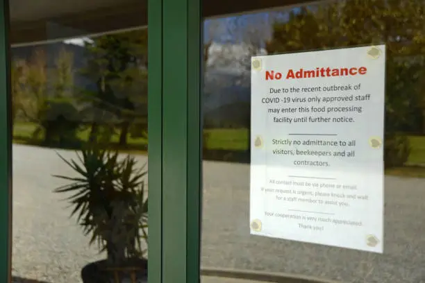 Signage shows that an essential food processing business has restricted access during the Covid 19 lockdown in New Zealand, March 2020
