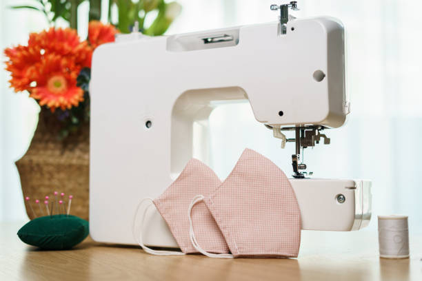 istock Fabrics, sewing accessories and sewing machine for sewing an anti-virus face mask during the coronavirus pandemia. 1218485828