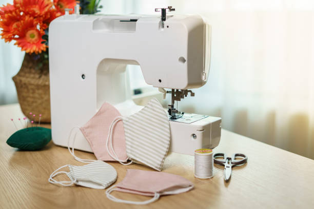 istock Fabrics, sewing accessories and sewing machine for sewing an anti-virus face mask during the coronavirus pandemia. 1218485849