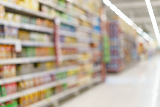 istock Supermarket blurred background fruit juice on shelves at grocery. 1218486105