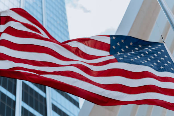istock USA flag blowing in the wind 1218488016