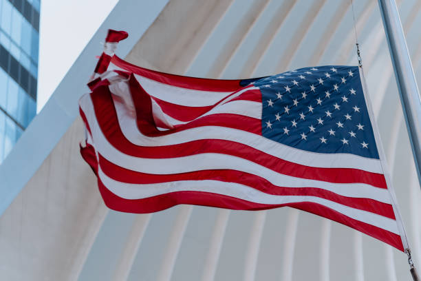 istock USA flag blowing in the wind 1218488030