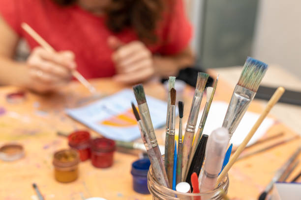 istock brushes for painting on blurred background of drawing process 1218488167