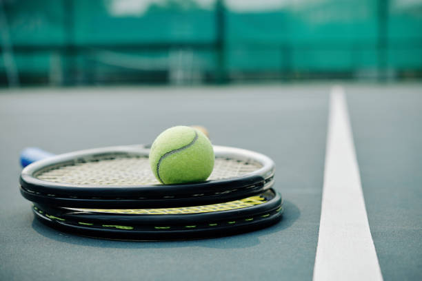 istock Two rackets and tennis ball 1218489066