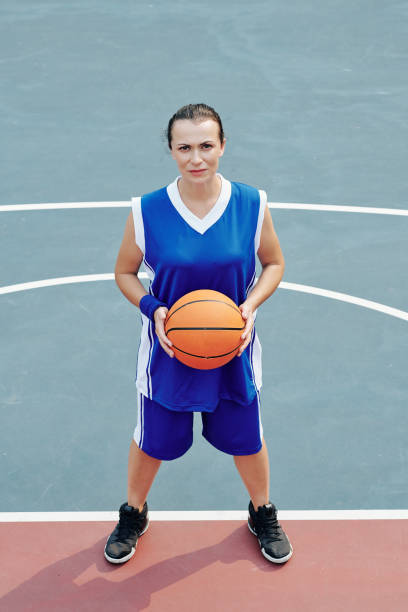 istock Serious female basketball player 1218489074