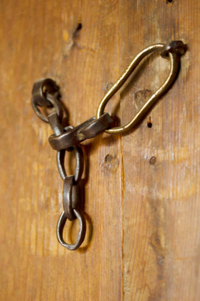 istock old wooden door and chain 1218489289