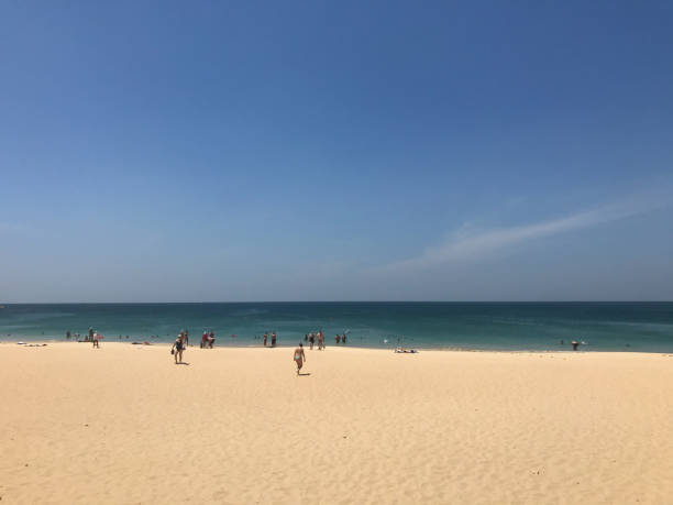 istock people are on the beach 1218491675