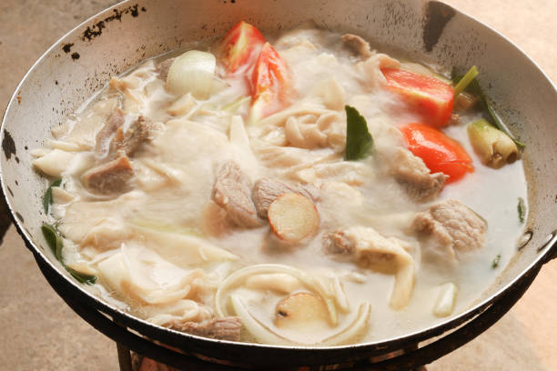 istock Boiled pork with mushrooms, kaffir lime leaves in a pan. 1218492555